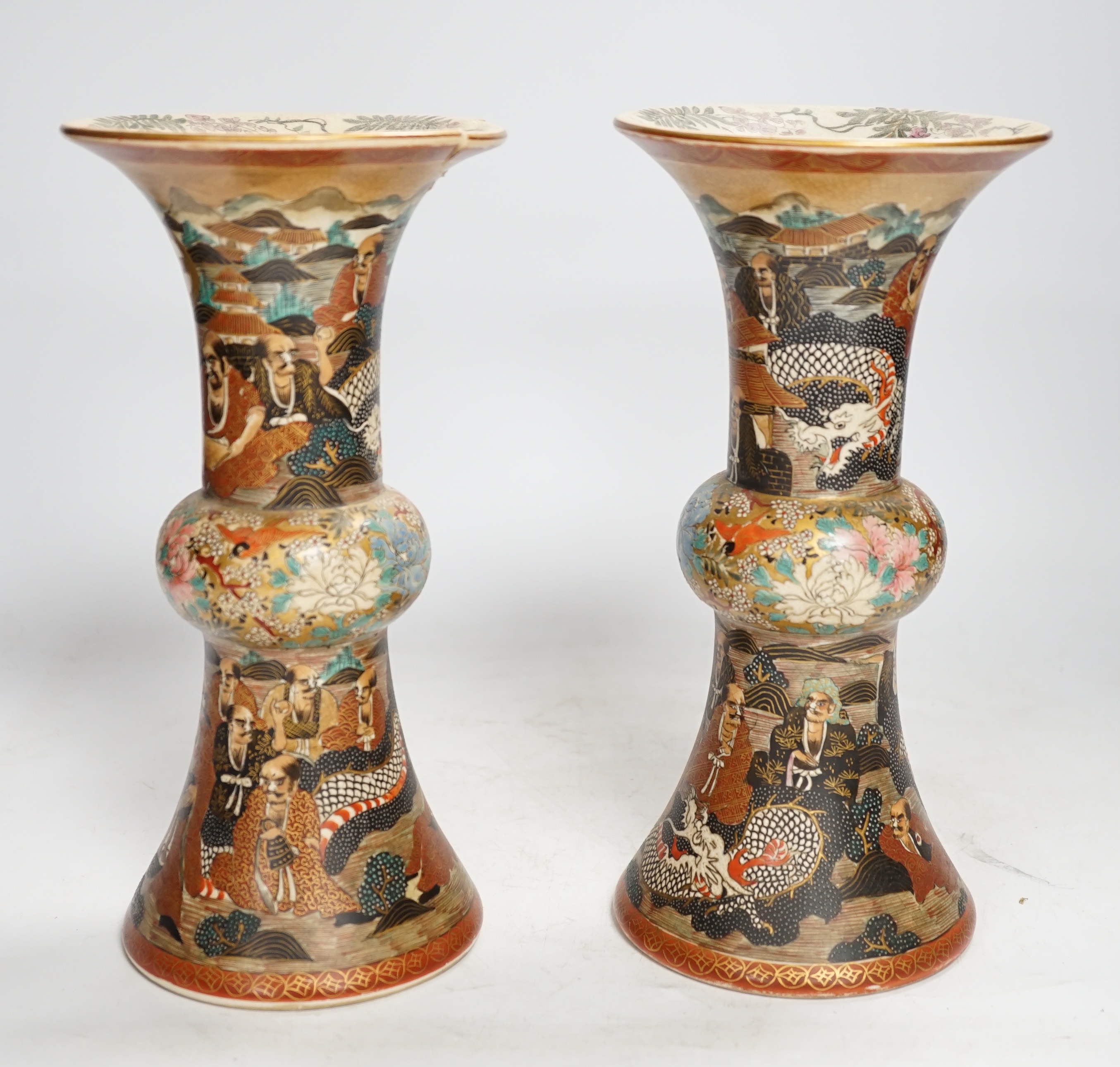 A pair of Japanese satsuma pottery 'rakan' vases, Meiji period, 24.5cm high (one a.f.). Condition - fair to good